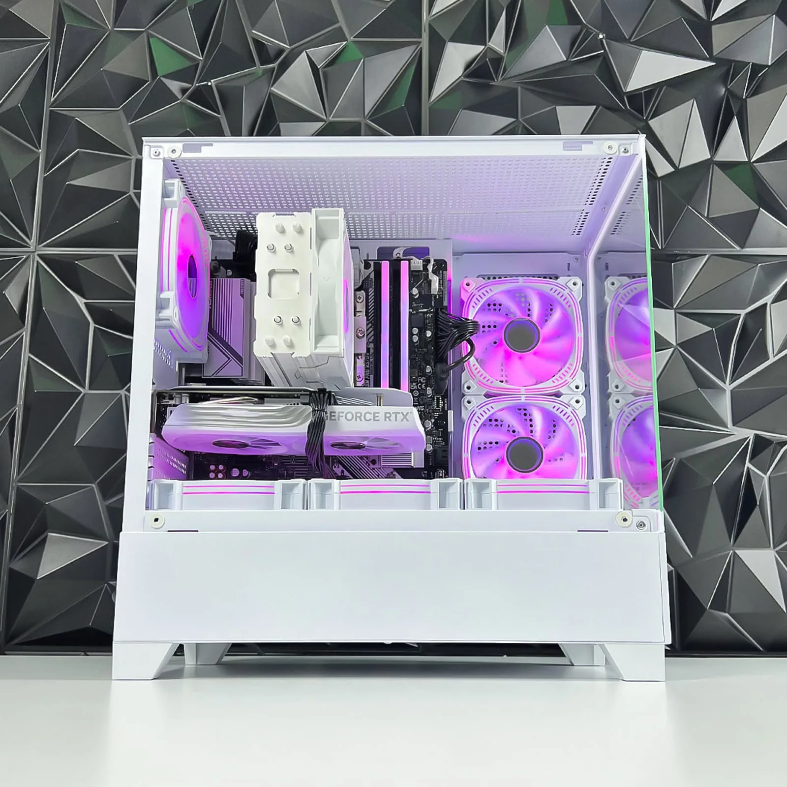 Interior view of the Game Sekret Nova Air white RGB gaming PC with GeForce RTX GPU and pink lighting.